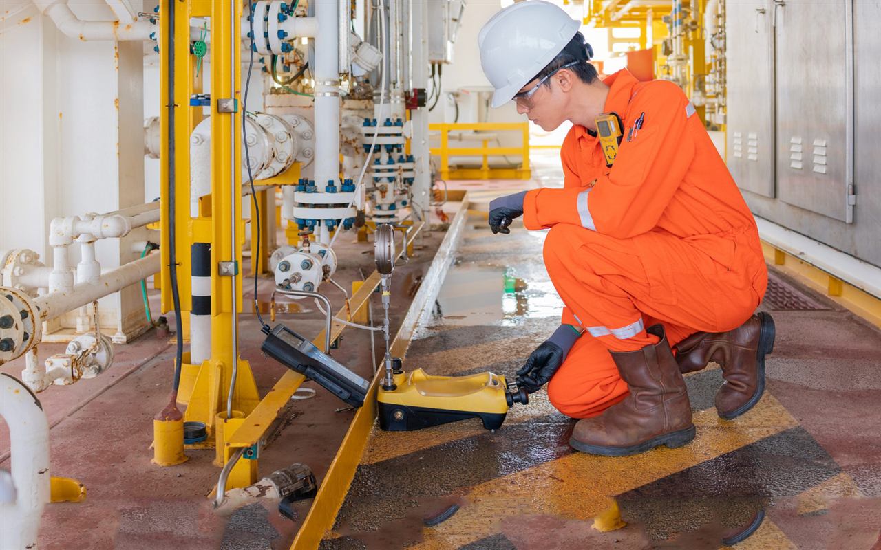 Technician performing equipment inspection